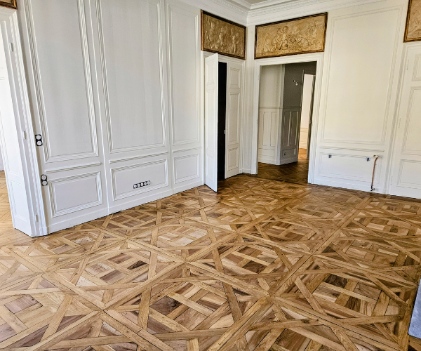 Parquet motif Versailles rénové dans un appartement à Lyon 2 avec ponçage et vitrification